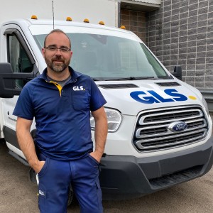 GLS Independent Contractor standing in front of a cube van.