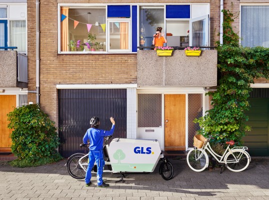 two guys looking at parcels in warehouse