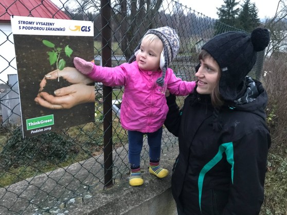 Planting trees and poniting at signs