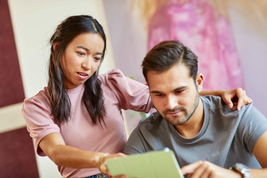 Young couple using a tablet