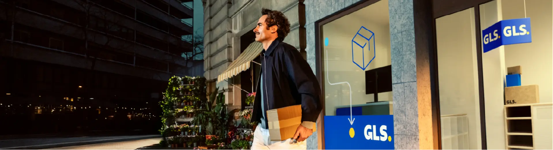Man walks out of GLS pick-up point with package in hand