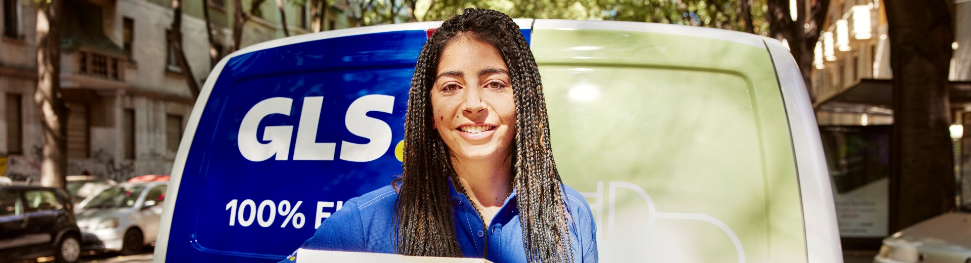 GLS employee smiles for the camera