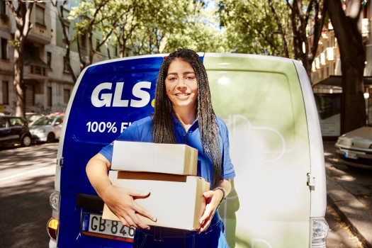 GLS employee smiles for the camera