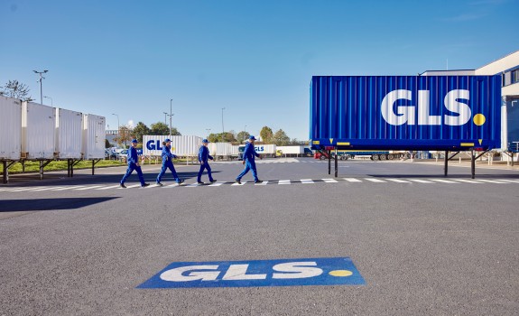 GLS employees walking along the crosswalk