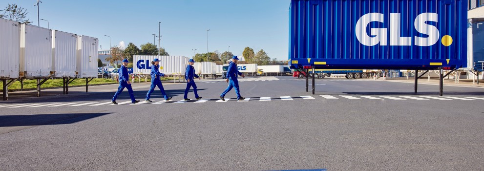 GLS employees walking along the crosswalk