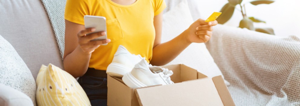 Young woman discovering her online purchase