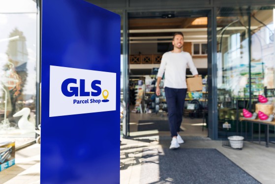 GLS driver in front of a Parcel Shop